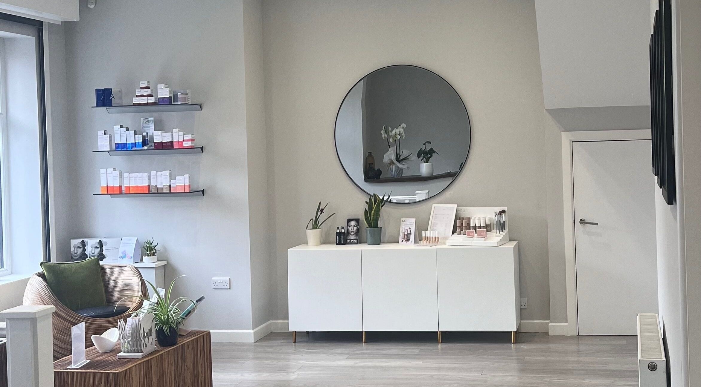 Cozy waiting area at Skinergy by Leona, Manchester, England, GB, featuring elegant decor and skincare products.