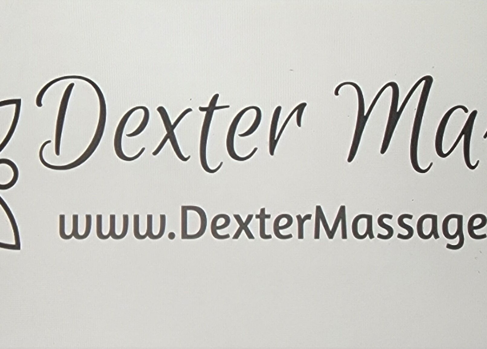 Dexter Massage logo at Verapose Yoga House in Dexter, Michigan, US, showcasing their online presence.