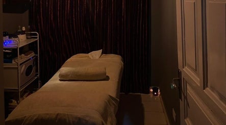 Cozy massage room ambiance at Prestige Luxe Spa, Accra, Greater Accra Region, GH, with soft lighting.
