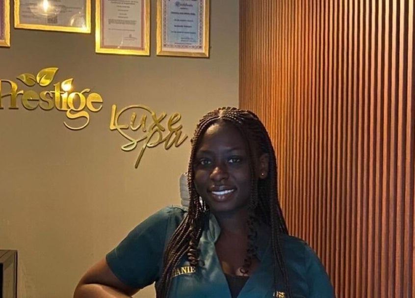 Friendly staff at Prestige Luxe Spa's reception area in Accra, Greater Accra Region, GH. Warm hospitality awaits.