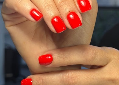 Vibrant red manicure at Beauty By Lid Nail Studio in Santa Clarita, California, US.
