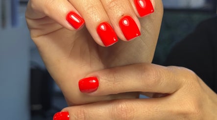Vibrant red manicure at Beauty By Lid Nail Studio in Santa Clarita, California, US.
