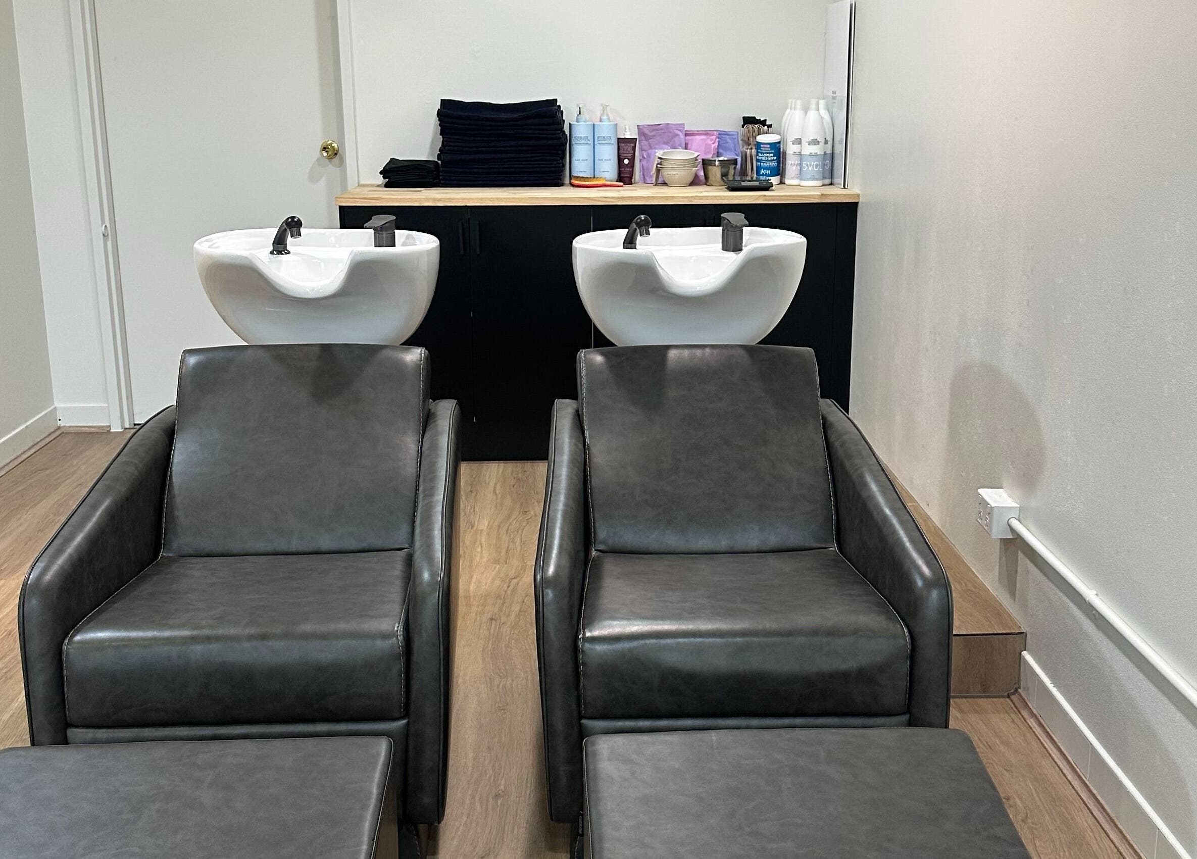Elegant hair wash stations at Hair by Laura Marie, Mount Annan, New South Wales, AU, showcasing modern amenities.