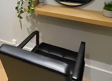 Modern styling chair at Yas Did My Hair, Bedford, England, GB, offering a stylish and comfortable salon experience.