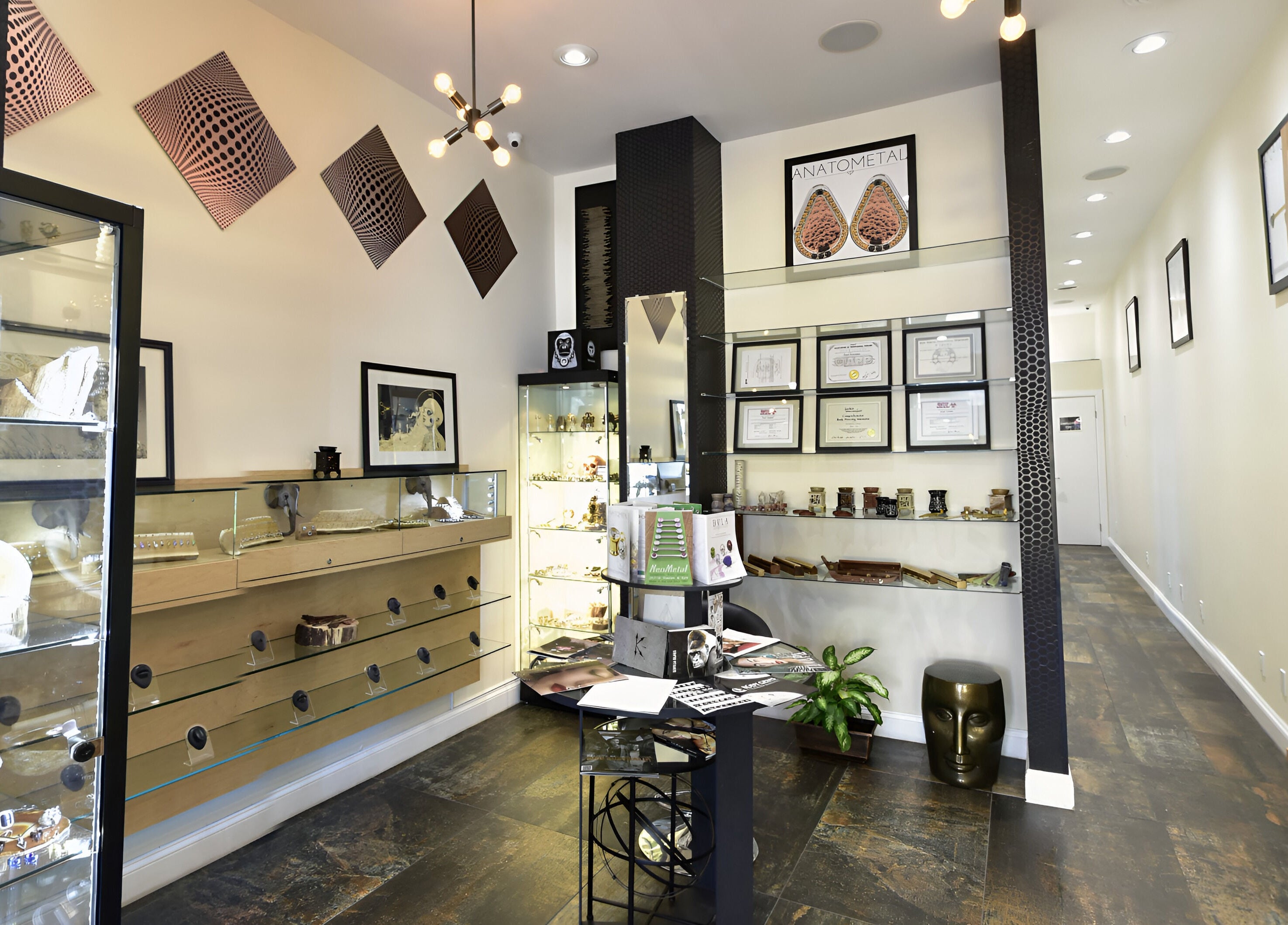 Interior of True Expression Piercing Studio, showcasing modern decor and jewelry displays in New York, New York, US.