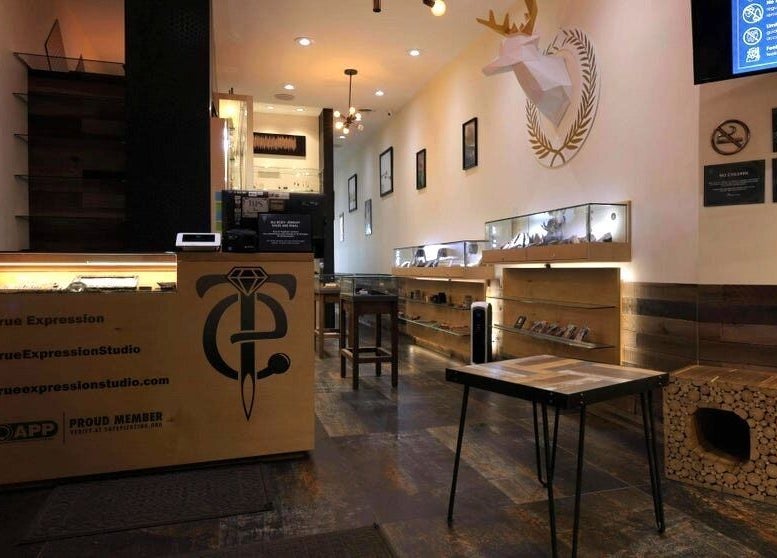 Interior of True Expression Piercing Studio in New York, New York, US showcasing modern design and decor.