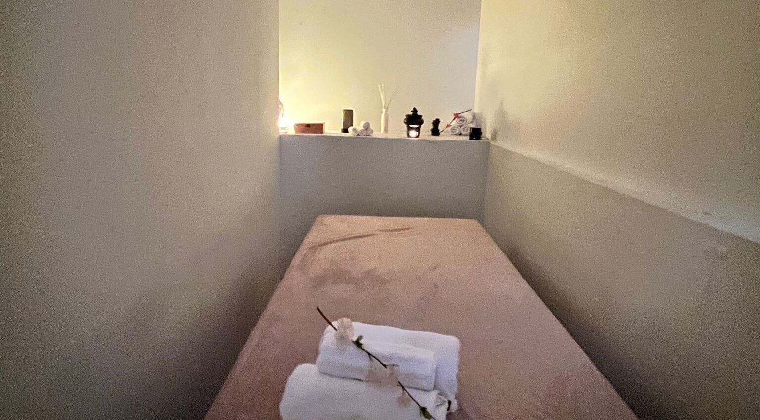Tranquil massage room at Thai Massage Amsterdam, Amsterdam, Noord-Holland, NL with soft lighting and cozy bed.