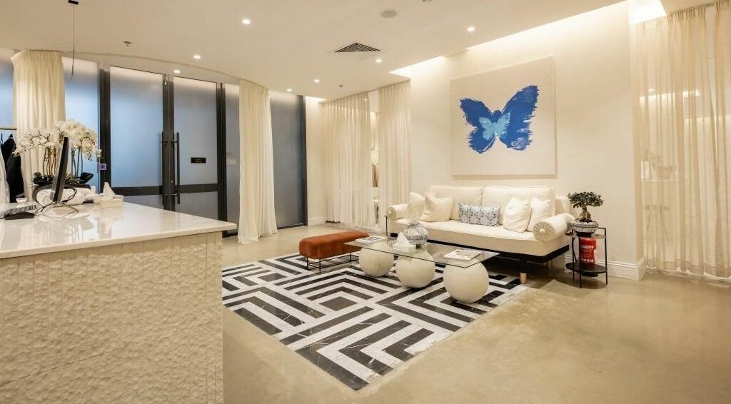 Elegant reception area of Aya Salon in Riyadh, Riyadh Province, SA with plush seating and artistic decor.