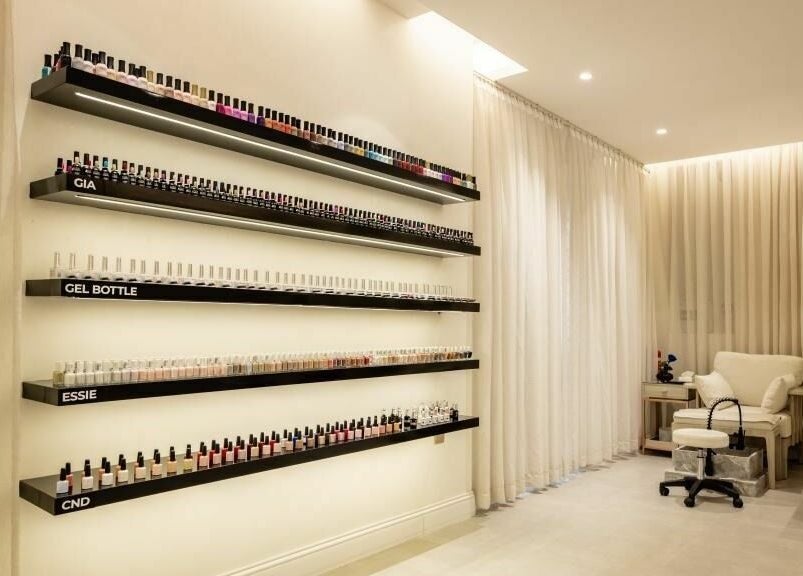 Nail polish display and cozy chair at Aya Salon, Riyadh, Riyadh Province, SA. Inviting beauty space.