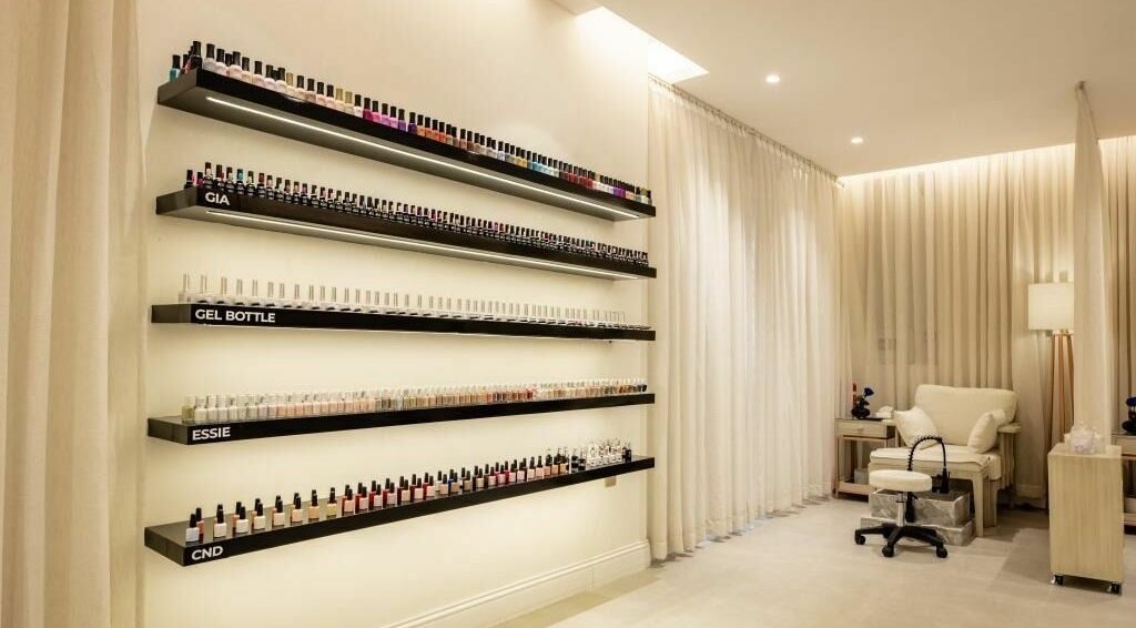 Nail polish display and cozy chair at Aya Salon, Riyadh, Riyadh Province, SA. Inviting beauty space.