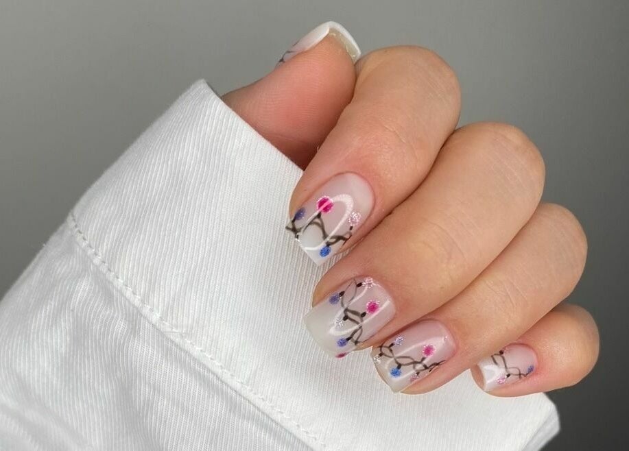 Elegant floral nail art at Aya Salon, Riyadh, Riyadh Province, SA. Delicate design on manicured nails.