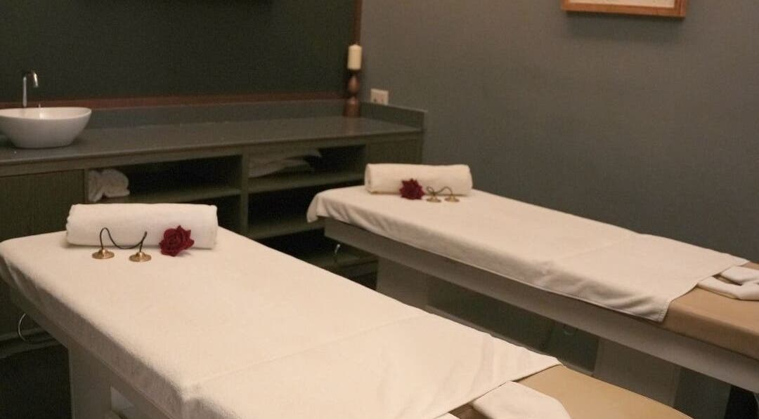 Relaxing massage room at DWS-Barcelo Al Jaddaf, Dubai, Dubai, AE, featuring two treatment tables with white linens.