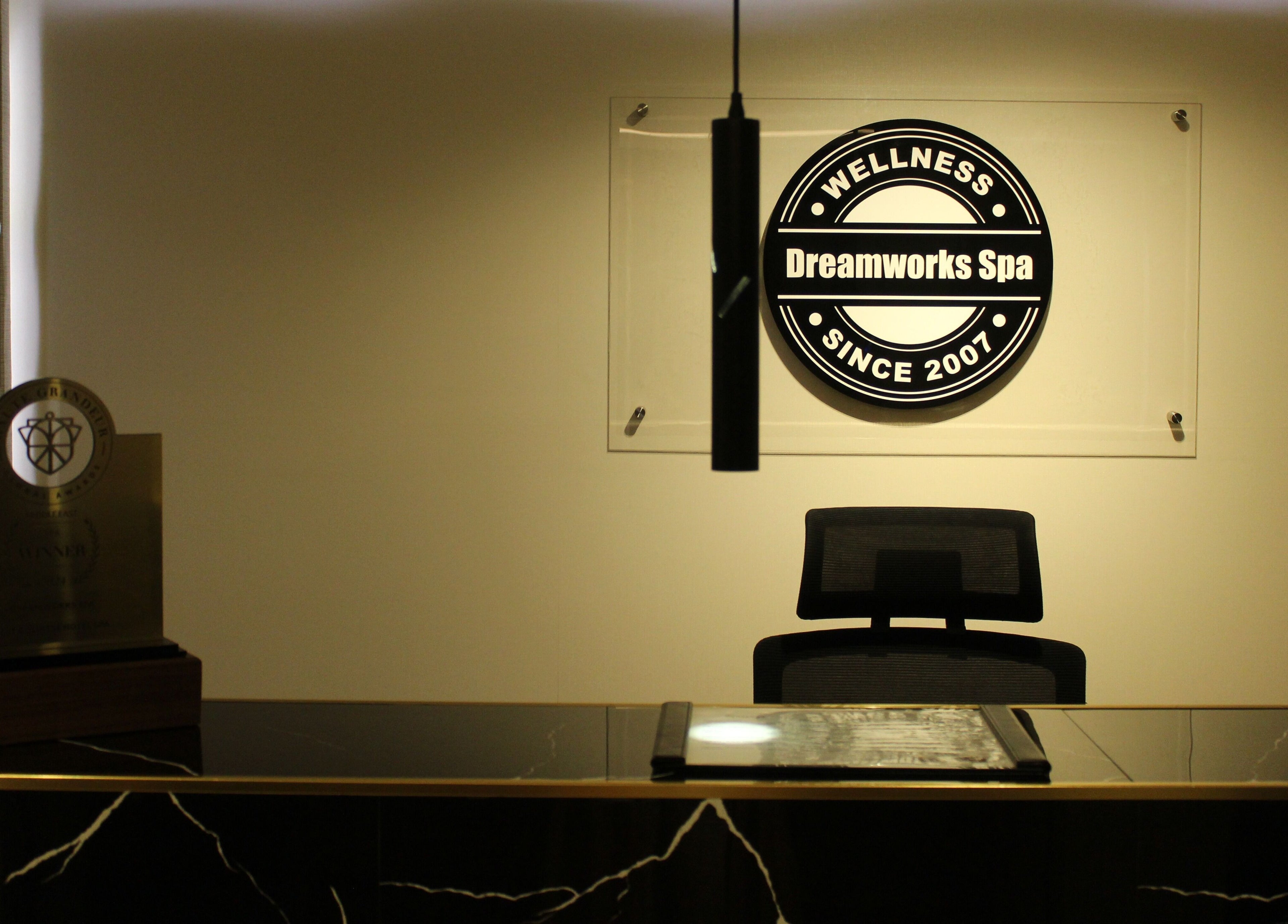 Elegant reception at DWS-Barcelo Al Jaddaf, Dubai, AE, showcasing award and spa logo.