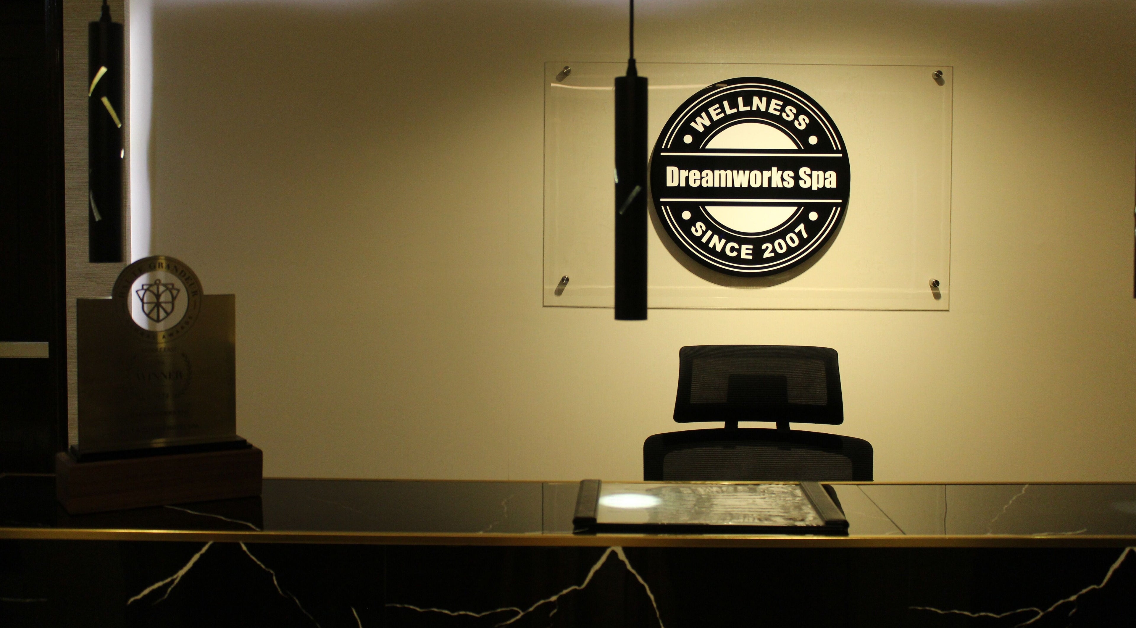 Elegant reception at DWS-Barcelo Al Jaddaf, Dubai, AE, showcasing award and spa logo.