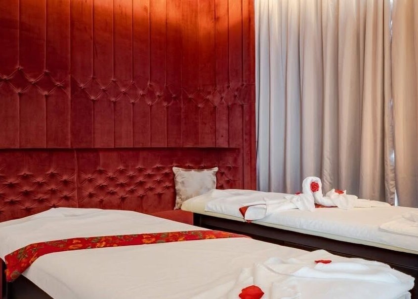 Luxurious massage room at DWS-Barcelo Al Jaddaf, Dubai, Dubai, AE, featuring elegant red velvet decor.