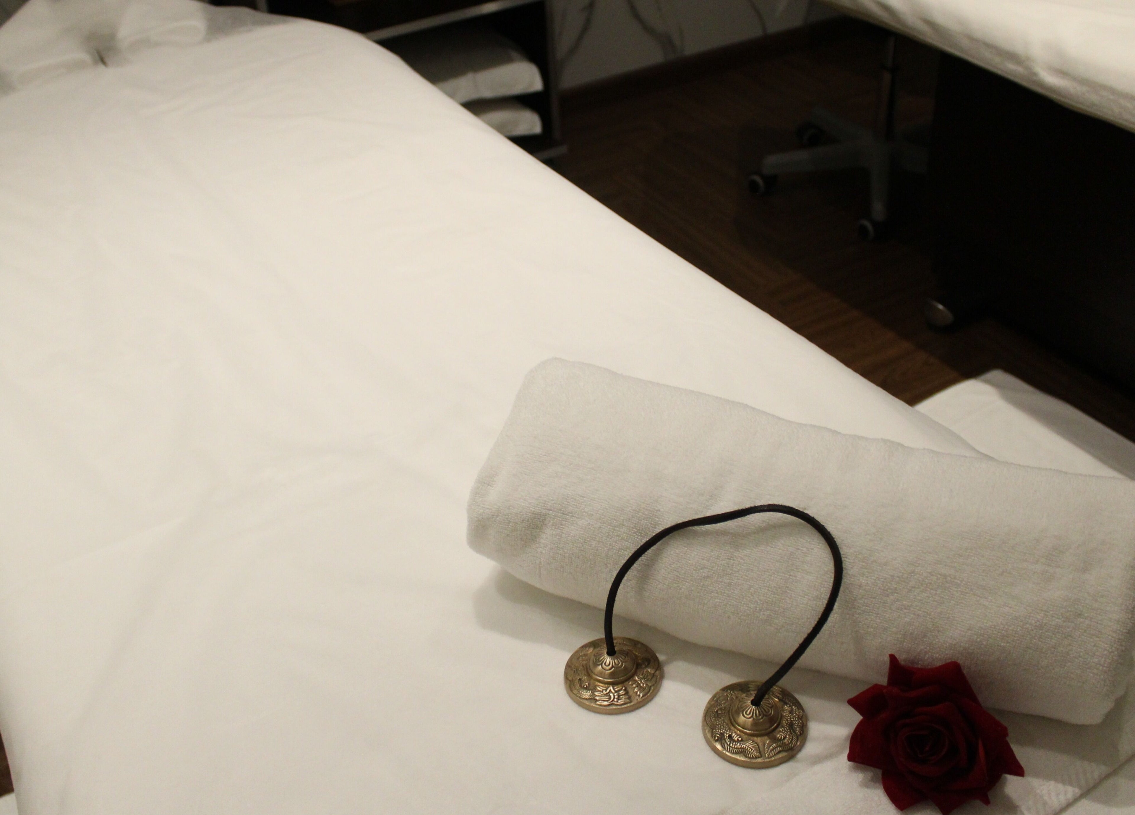 Relaxing massage suite at DWS-Barcelo Al Jaddaf, Dubai, Dubai, AE with rolled towel and decor.