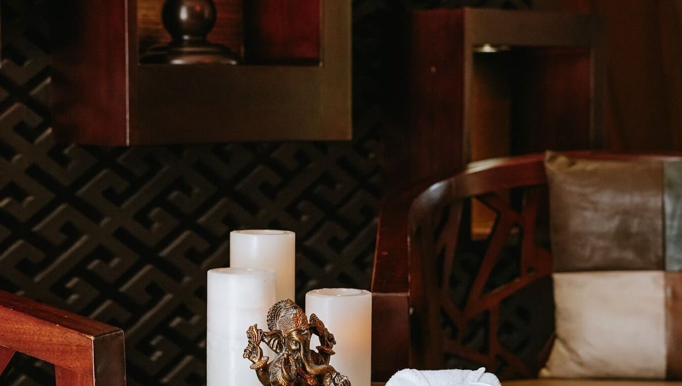 Elegant spa setting with candles and decor at DWS-Palm Jumeirah, Dubai, AE, offering a tranquil atmosphere.