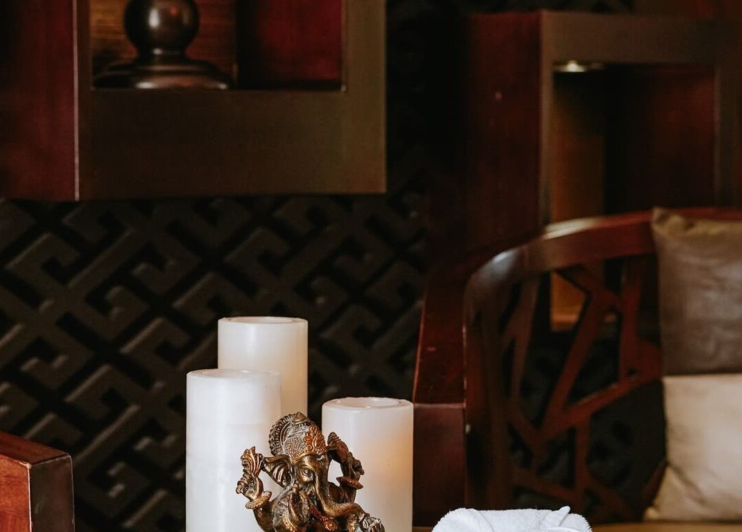 Elegant spa setting with candles and decor at DWS-Palm Jumeirah, Dubai, AE, offering a tranquil atmosphere.