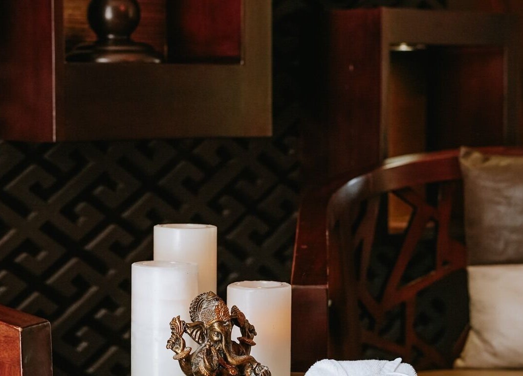 Elegant spa setting with candles and decor at DWS-Palm Jumeirah, Dubai, AE, offering a tranquil atmosphere.