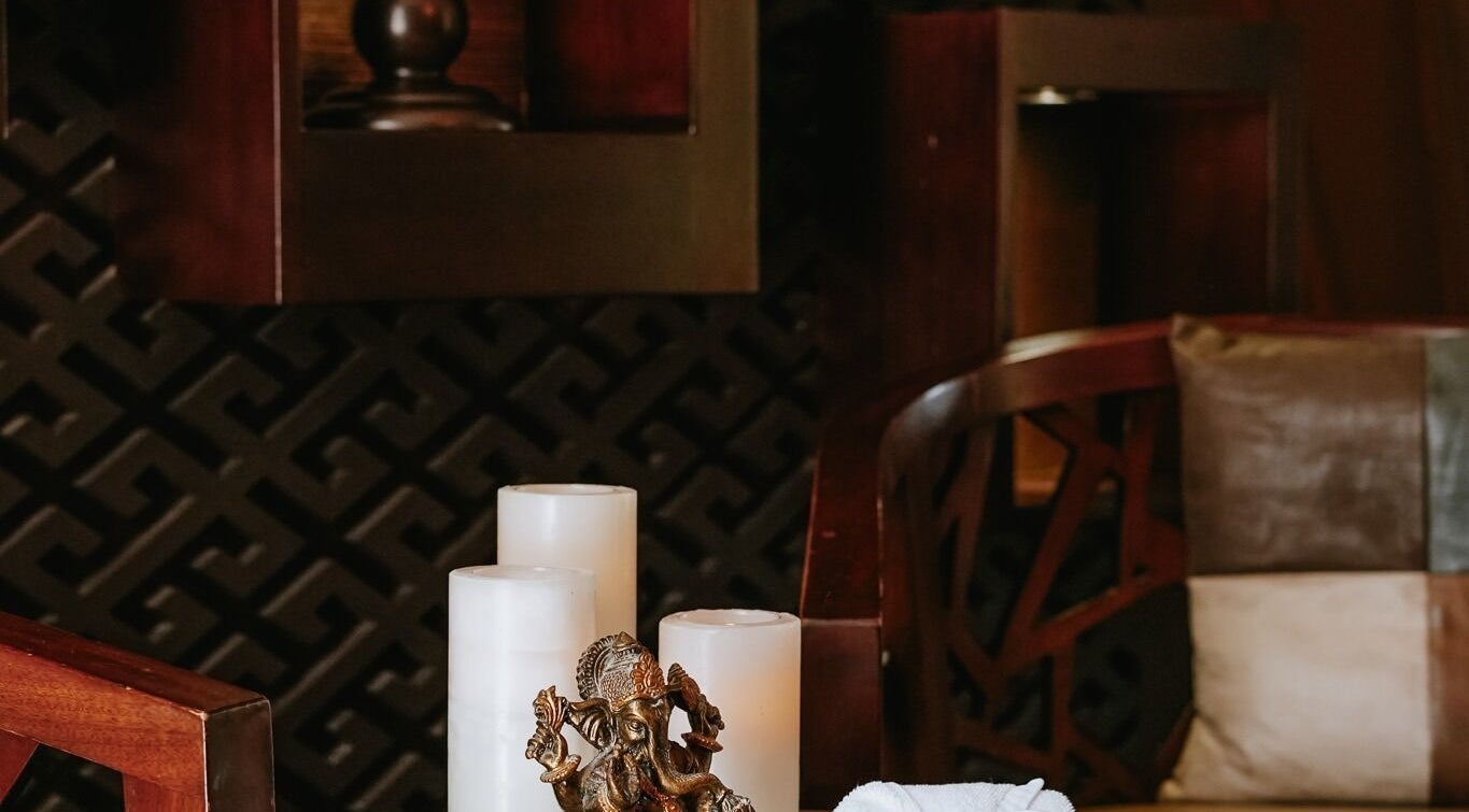 Elegant spa setting with candles and decor at DWS-Palm Jumeirah, Dubai, AE, offering a tranquil atmosphere.
