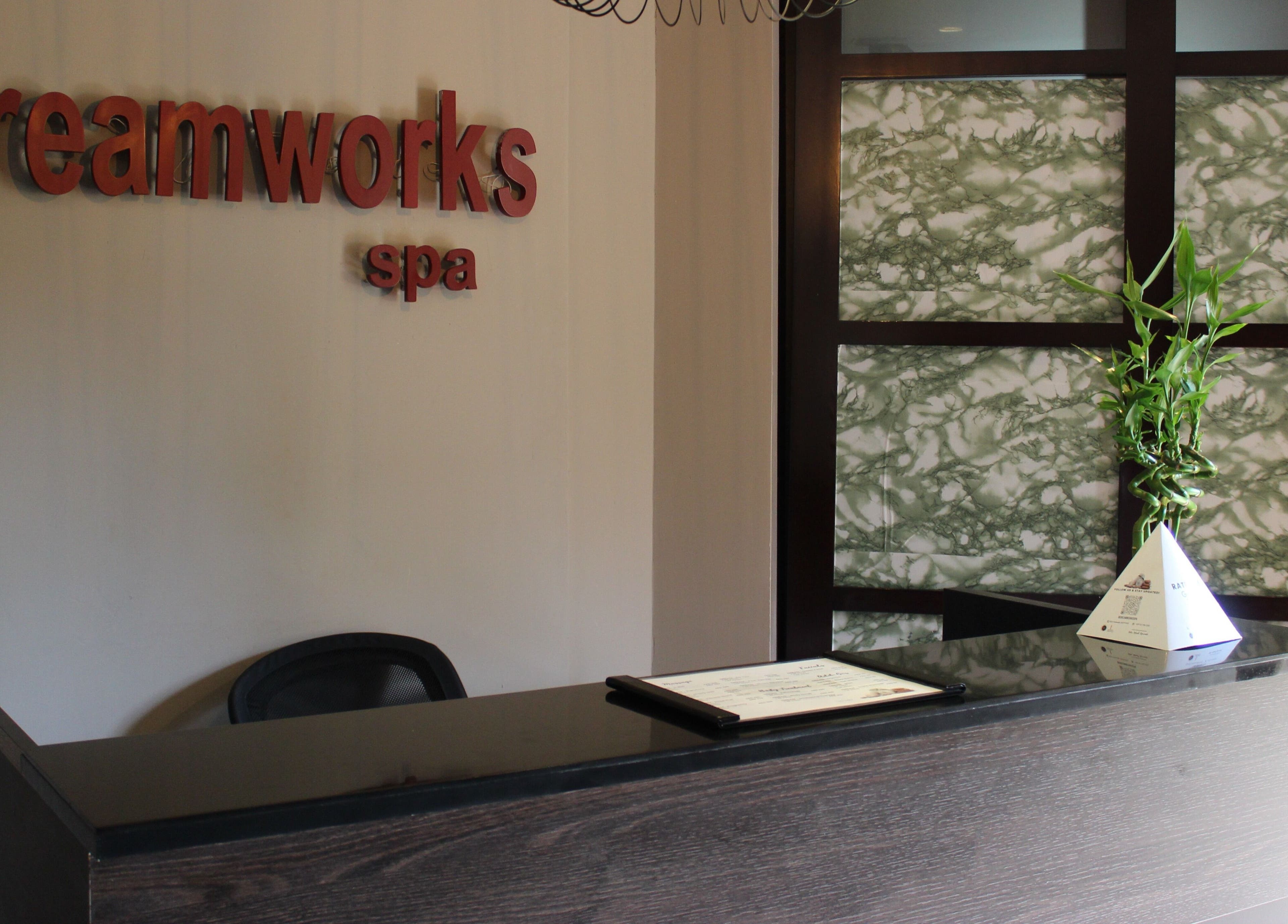 Elegant reception desk at DWS-Palm Jumeirah, Dubai, AE with bamboo decor, inviting atmosphere.