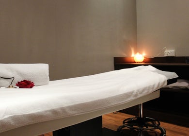 Serene massage room at DWS-Marina Cascades, Dubai, Dubai, AE, featuring a neatly prepared massage table.