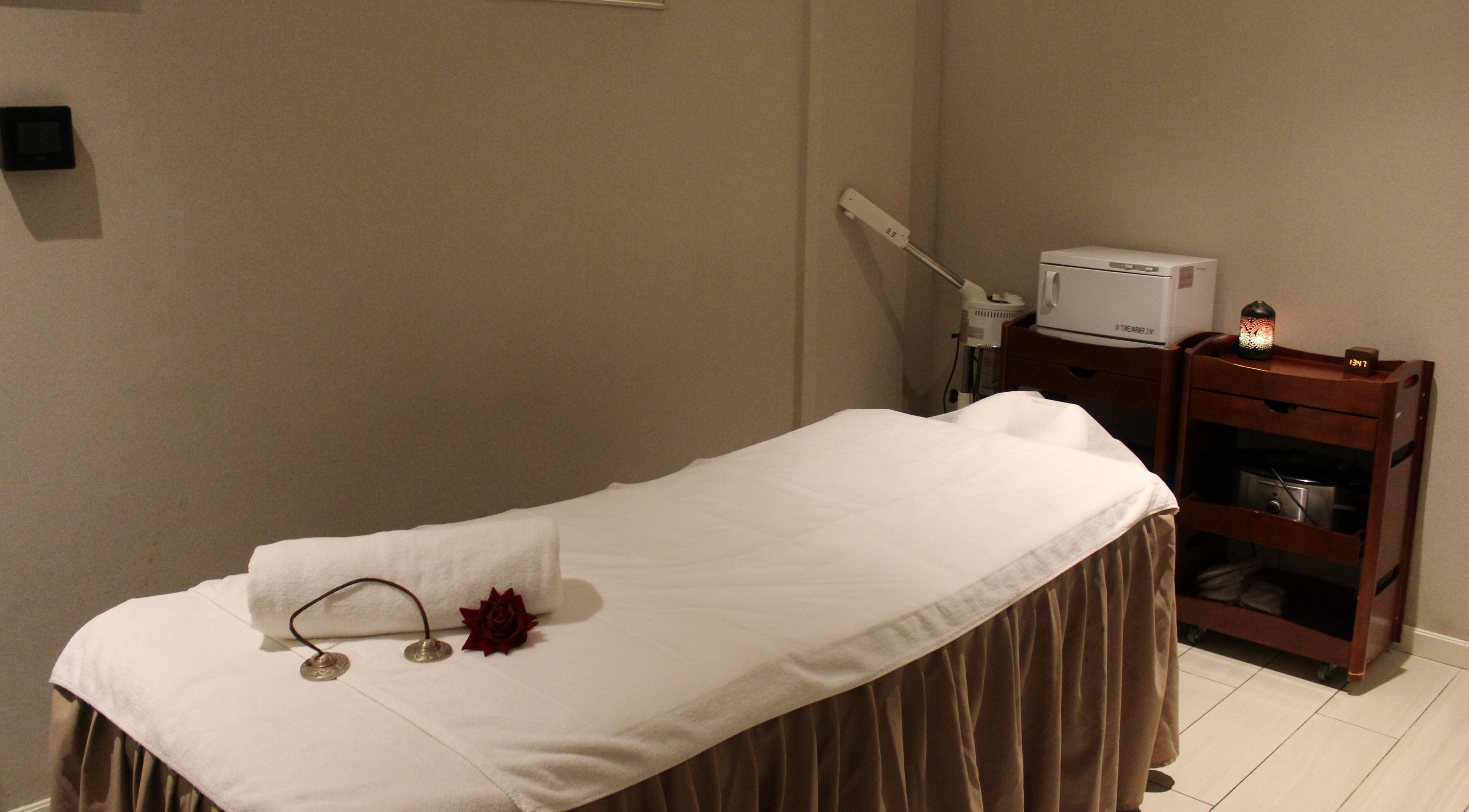 Relaxing spa treatment room at DWS-Aloft Hotel, Dubai, Dubai, AE with massage table and ambient lighting.