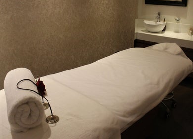 Tranquil spa room at DWS-Radisson Blu Waterfront in Dubai, Dubai, AE with massage table and peaceful ambiance.