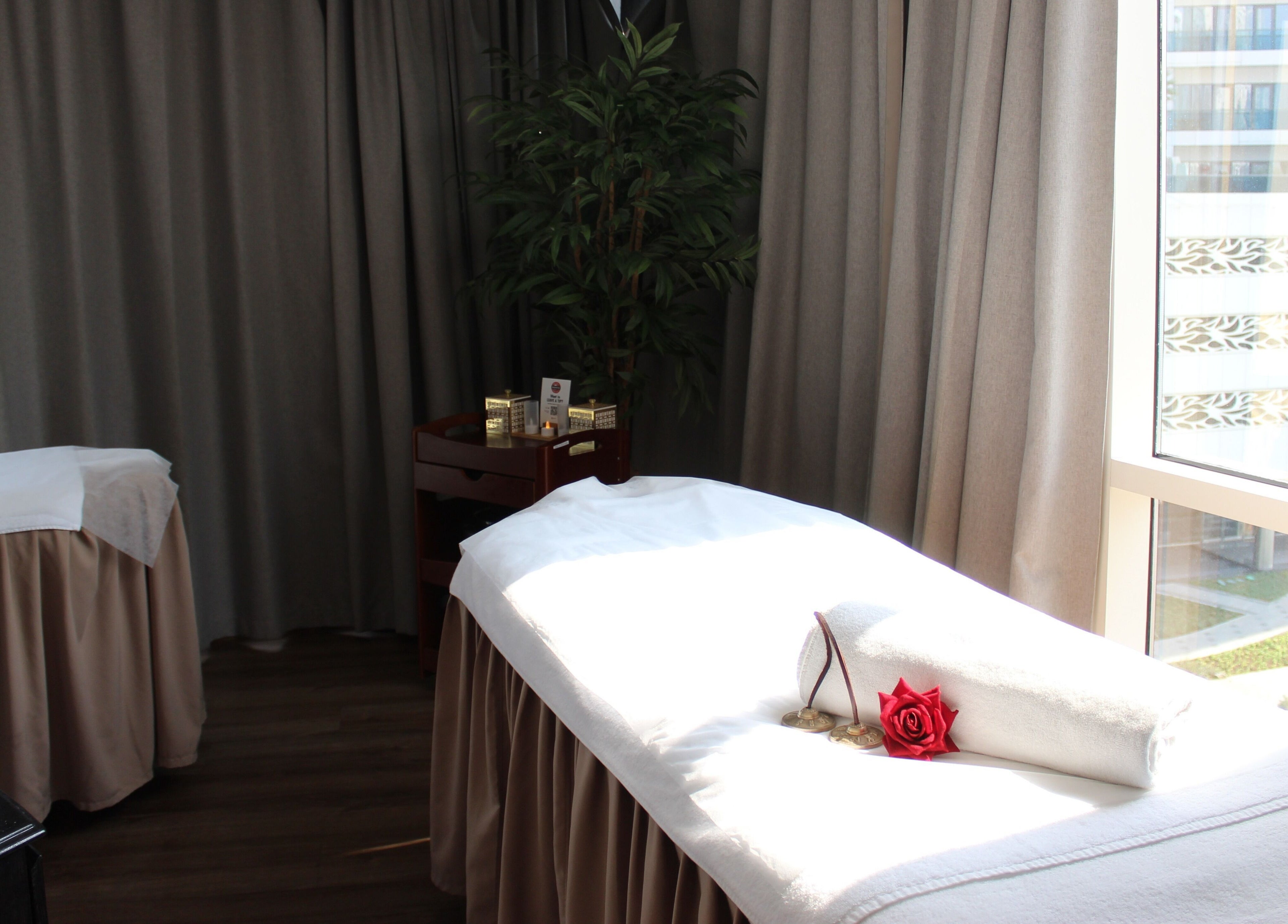 Relaxing spa treatment room at DWS-Radisson Canal View in Dubai, Dubai, AE, featuring a massage table.