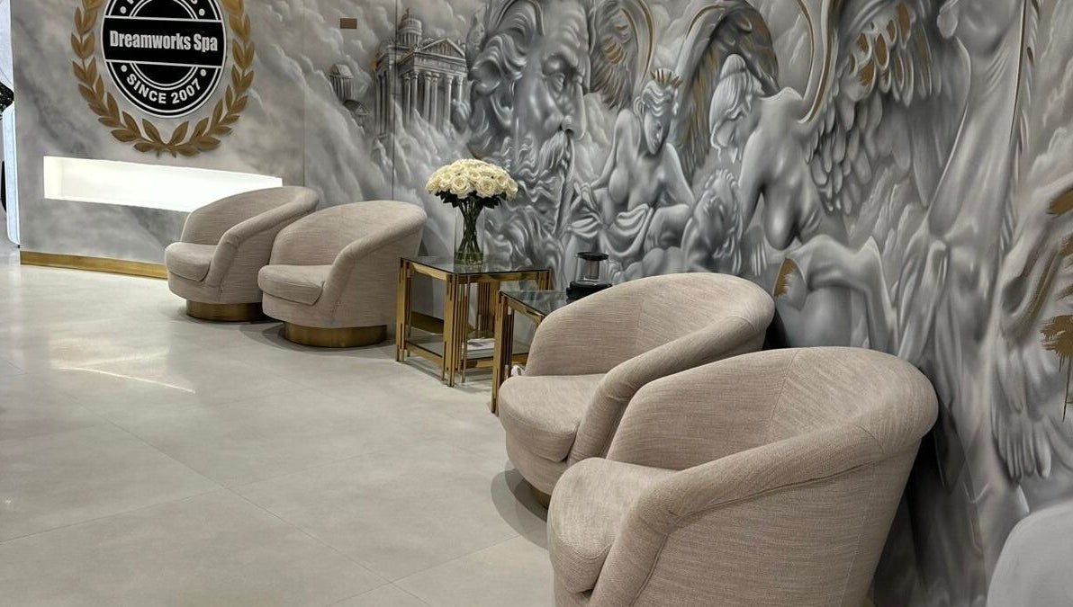 Luxurious lounge area at DWS-Damac Aykon City in Dubai, Dubai, AE, featuring plush chairs and artistic wall decor.