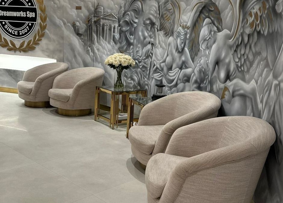 Luxurious lounge area at DWS-Damac Aykon City in Dubai, Dubai, AE, featuring plush chairs and artistic wall decor.