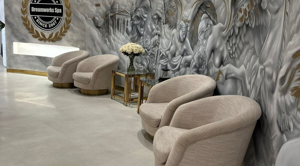 Luxurious lounge area at DWS-Damac Aykon City in Dubai, Dubai, AE, featuring plush chairs and artistic wall decor.