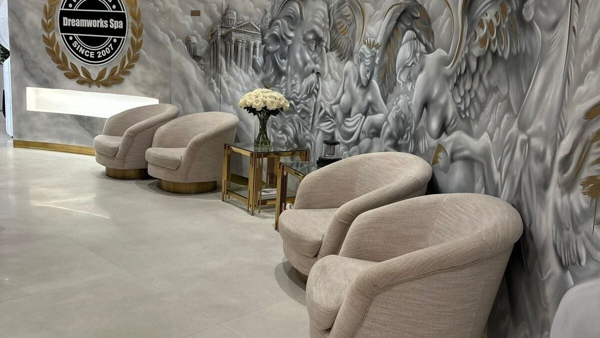 Luxurious lounge area at DWS-Damac Aykon City in Dubai, Dubai, AE, featuring plush chairs and artistic wall decor.