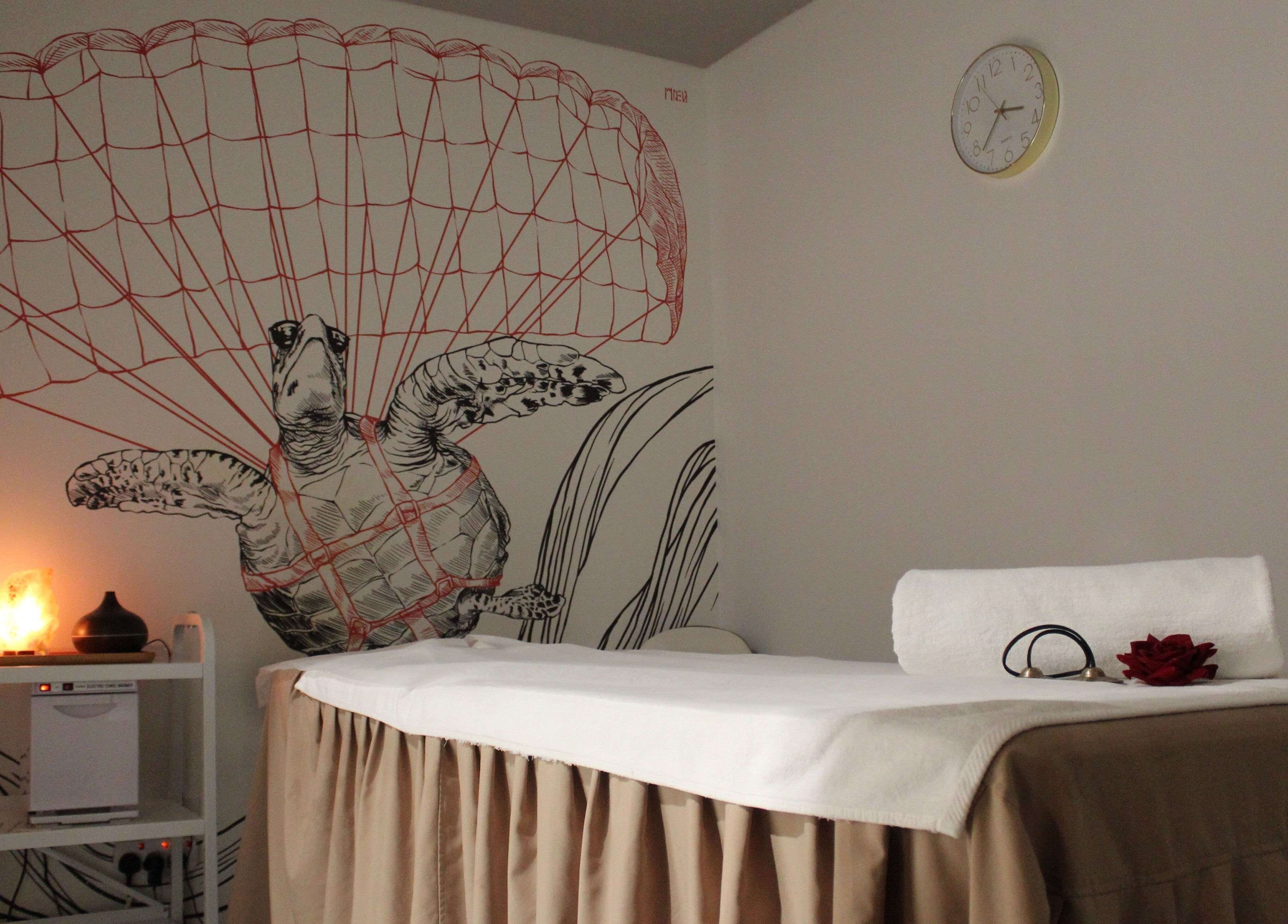 Relaxing spa room at DWS-Radisson Red Silicon Oasis, Dubai, Dubai, AE with turtle mural and soft lighting.