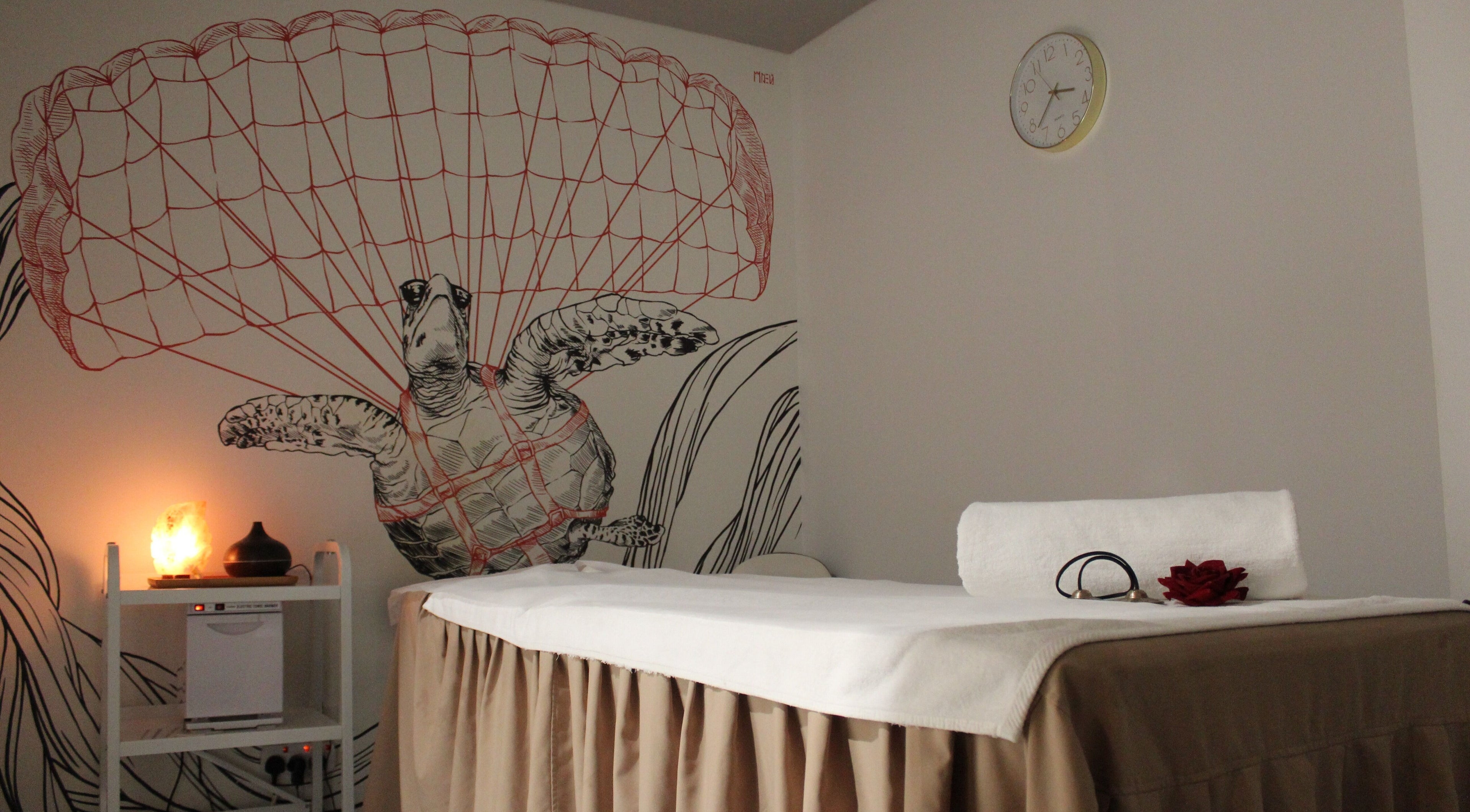 Relaxing spa room at DWS-Radisson Red Silicon Oasis, Dubai, Dubai, AE with turtle mural and soft lighting.