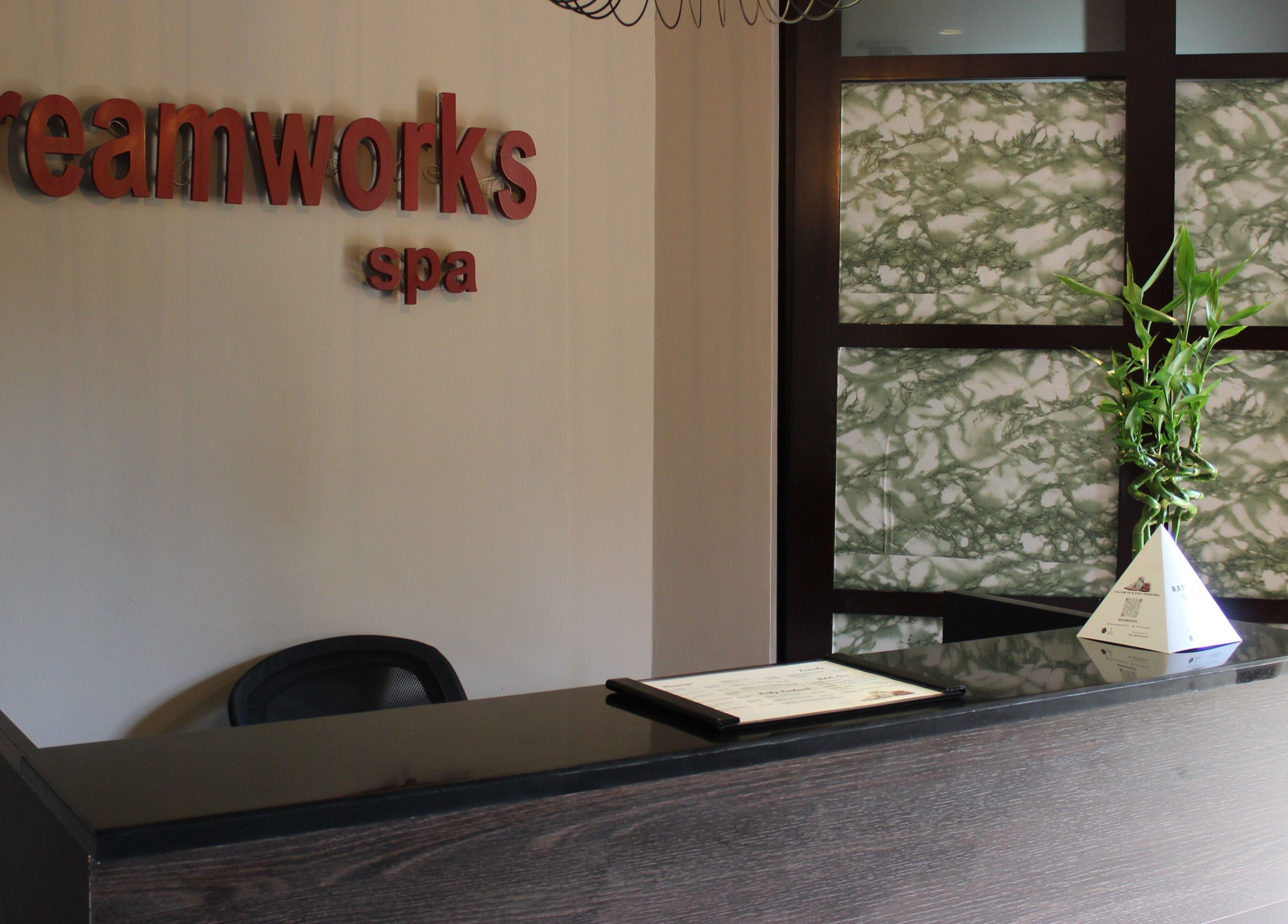 Reception area of DWS-Palm Jumeirah in Dubai, AE, featuring elegant decor and welcoming signage.