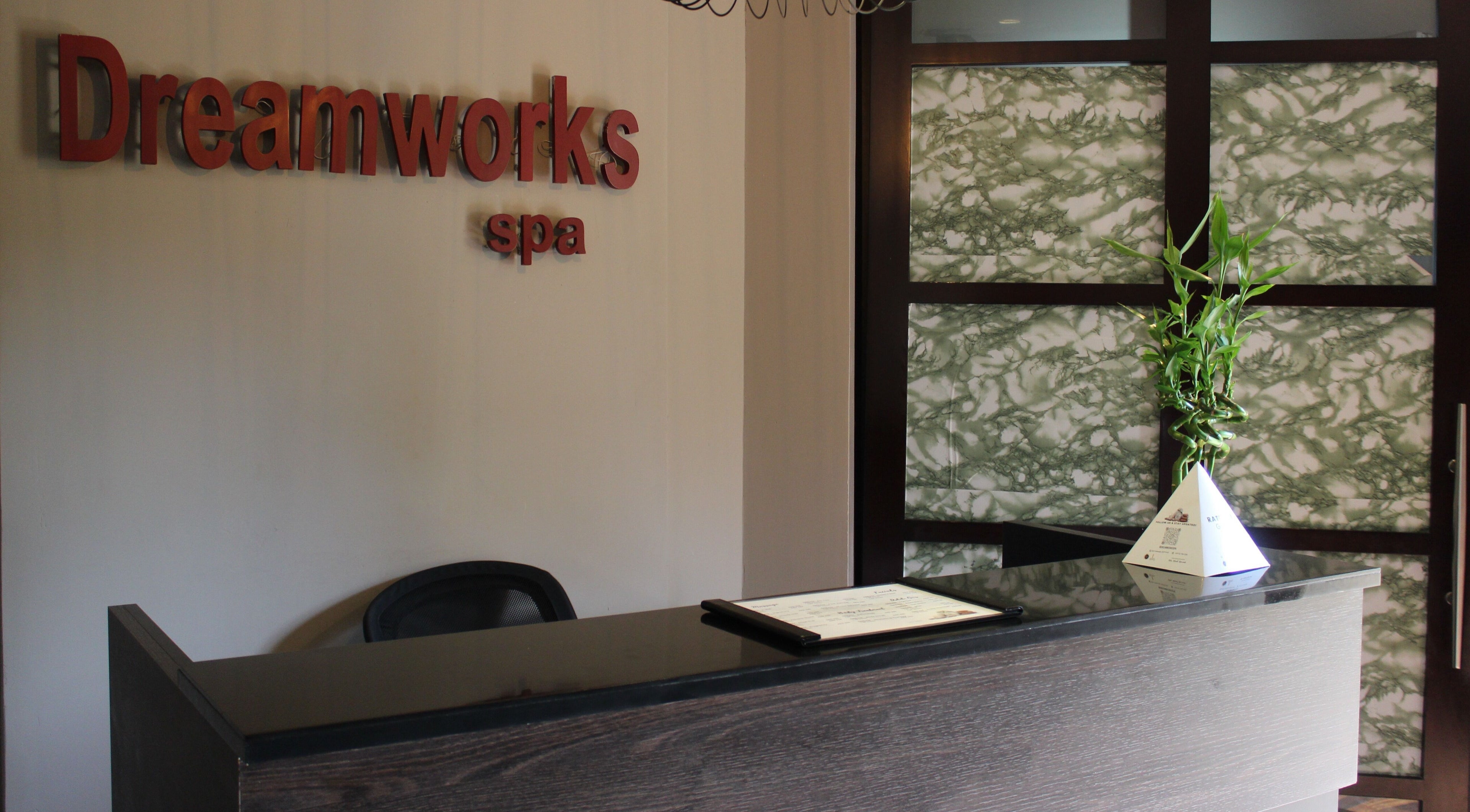 Reception area of DWS-Palm Jumeirah in Dubai, AE, featuring elegant decor and welcoming signage.