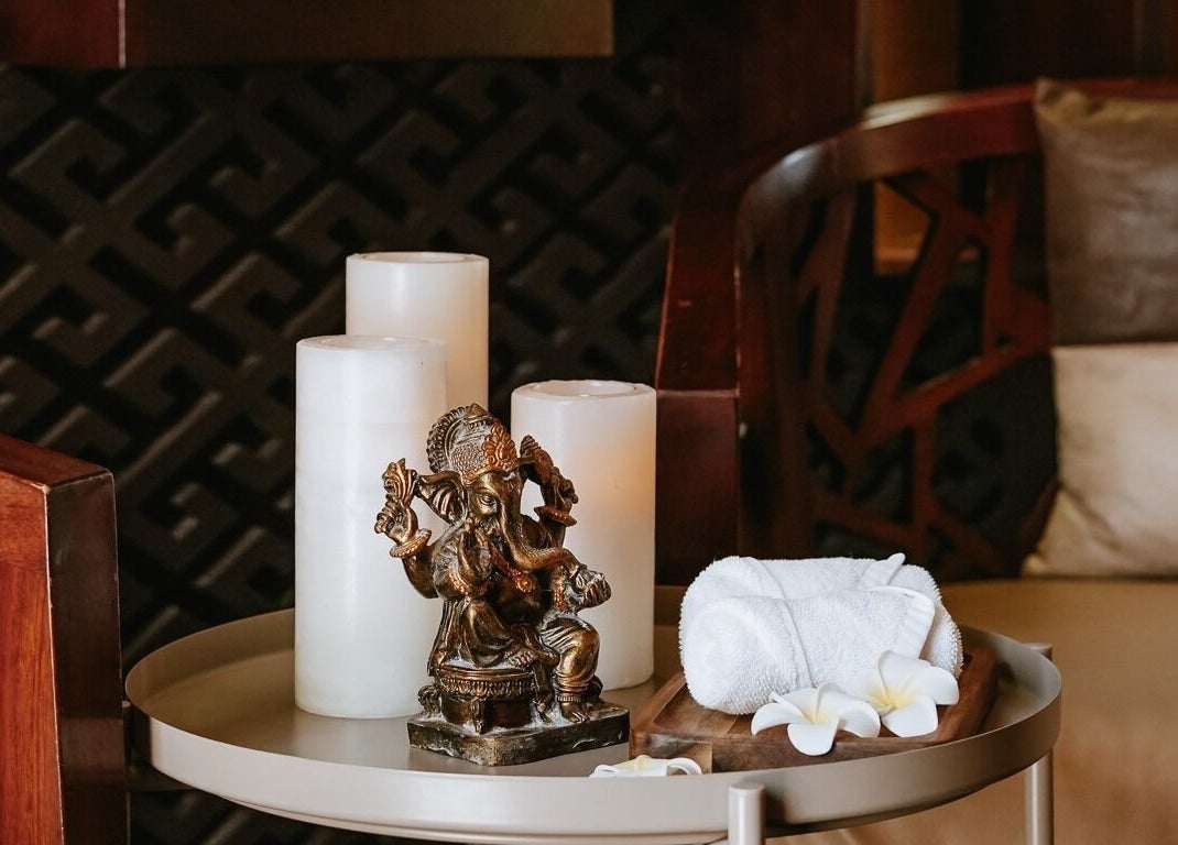Elegant spa decor with candles and statue at DWS-Palm Jumeirah, Dubai, AE.
