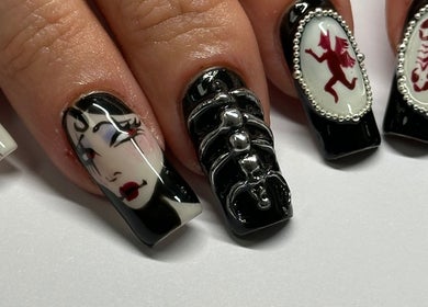Bold artistic nail art at Suki Nailz, London, England, GB, featuring detailed face and scorpion designs.