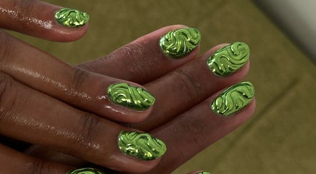 Green swirl nail art by Suki Nailz in London, England, GB. Showcasing intricate, glossy designs.