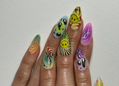 Vibrant nail art design from Suki Nailz at London, England, GB showcasing unique patterns and bold colors.
