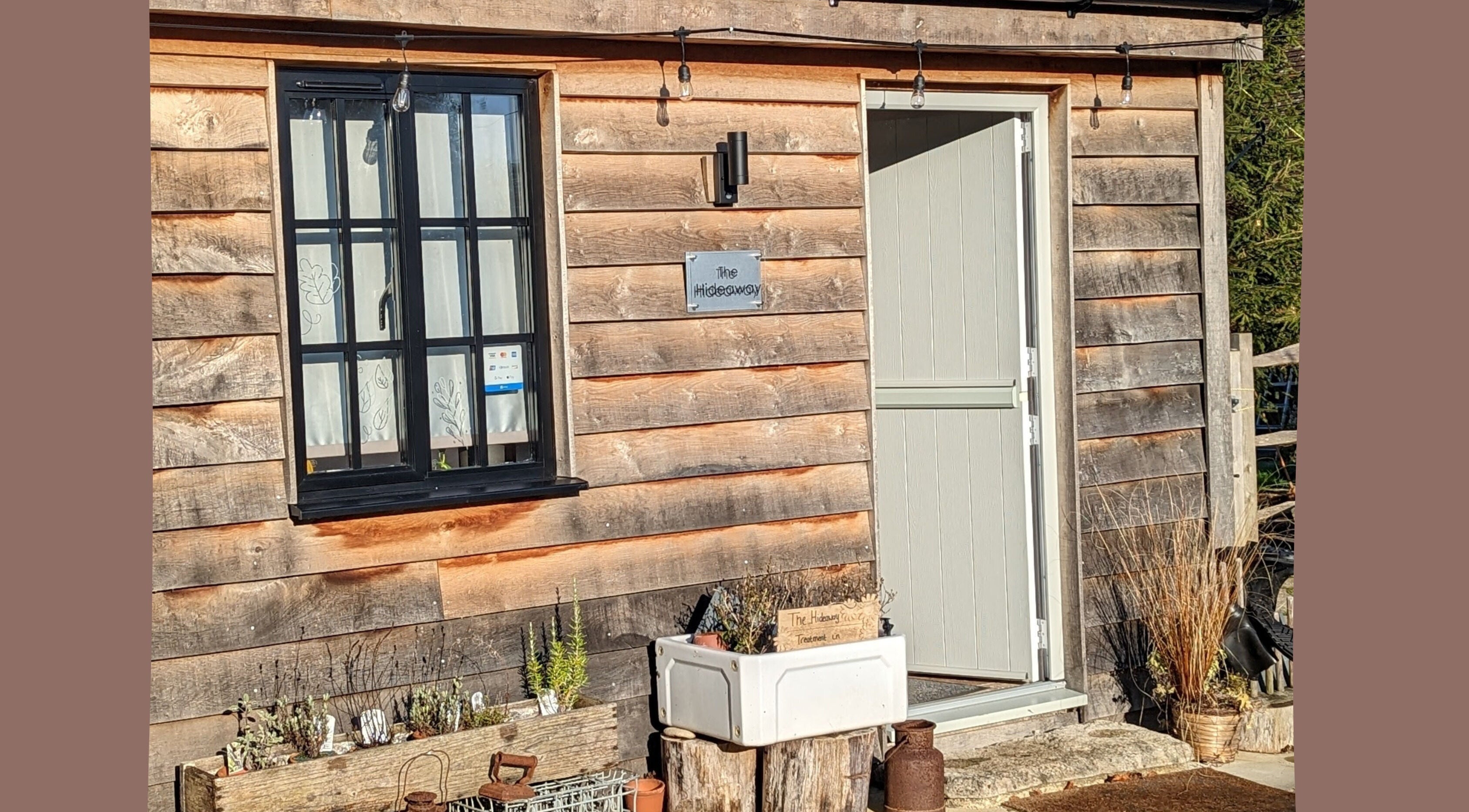 Entrance to Louise Palmer Holistics in Southampton, England, GB showcasing a rustic wooden cabin exterior.