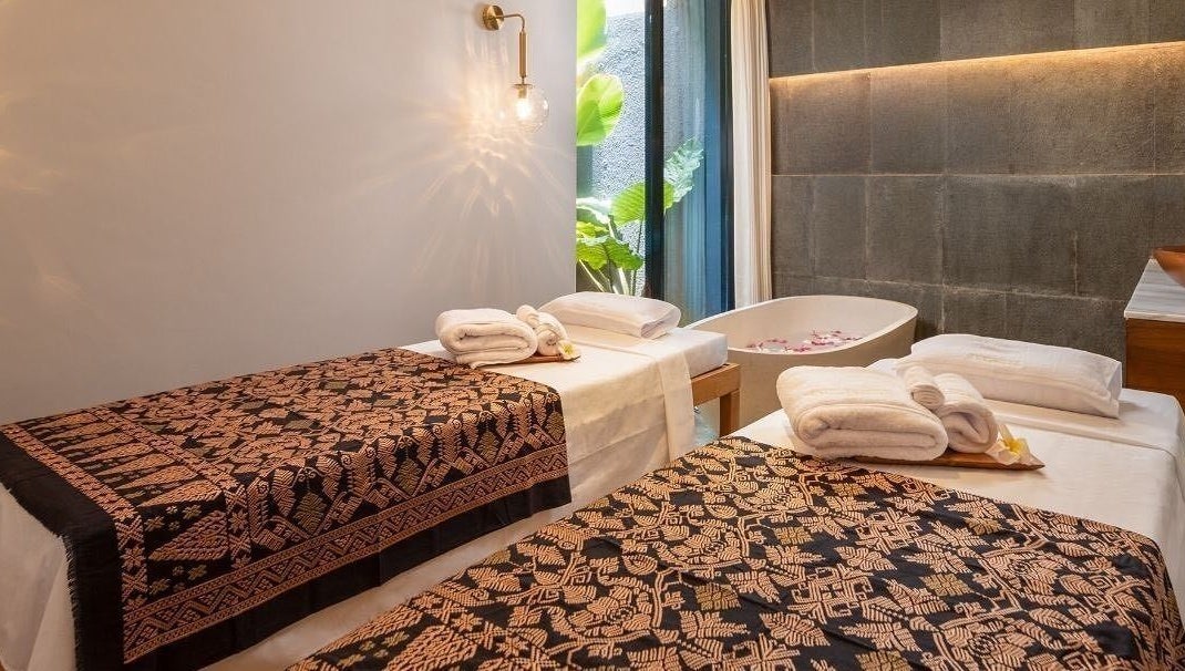 Relaxing massage room at Ame Spa Bali in Bali, Bali, ID with twin beds and a serene ambiance.