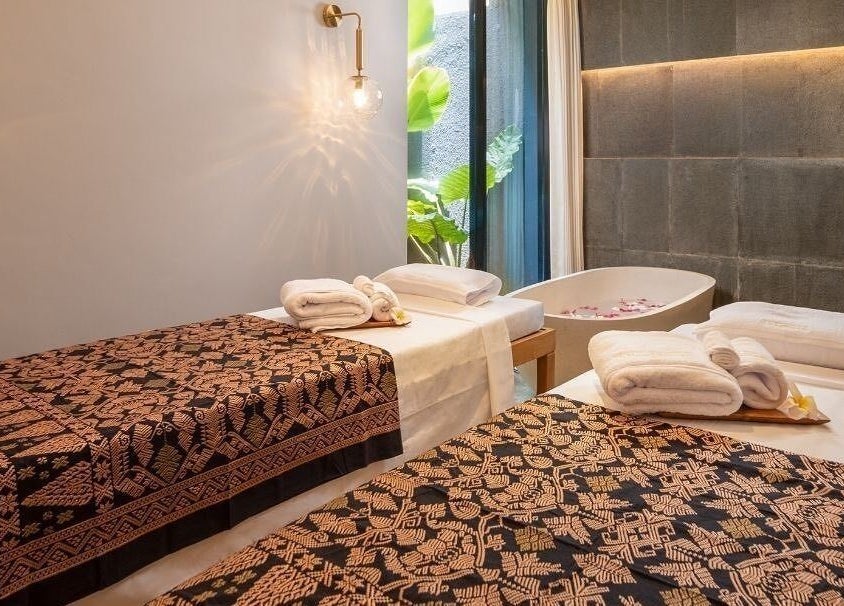 Relaxing massage room at Ame Spa Bali in Bali, Bali, ID with twin beds and a serene ambiance.
