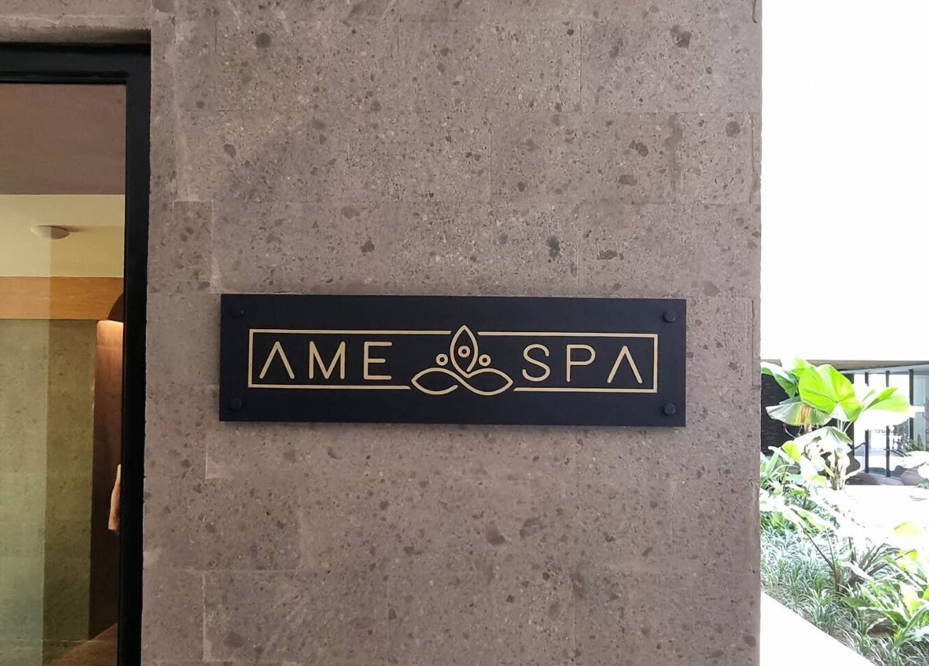 Entrance sign of Ame Spa Bali in Bali, ID, featuring elegant design elements.