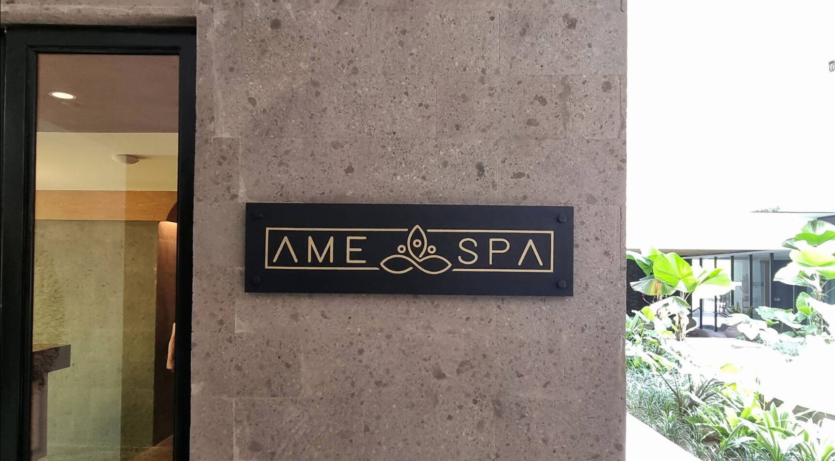 Entrance sign of Ame Spa Bali in Bali, ID, featuring elegant design elements.