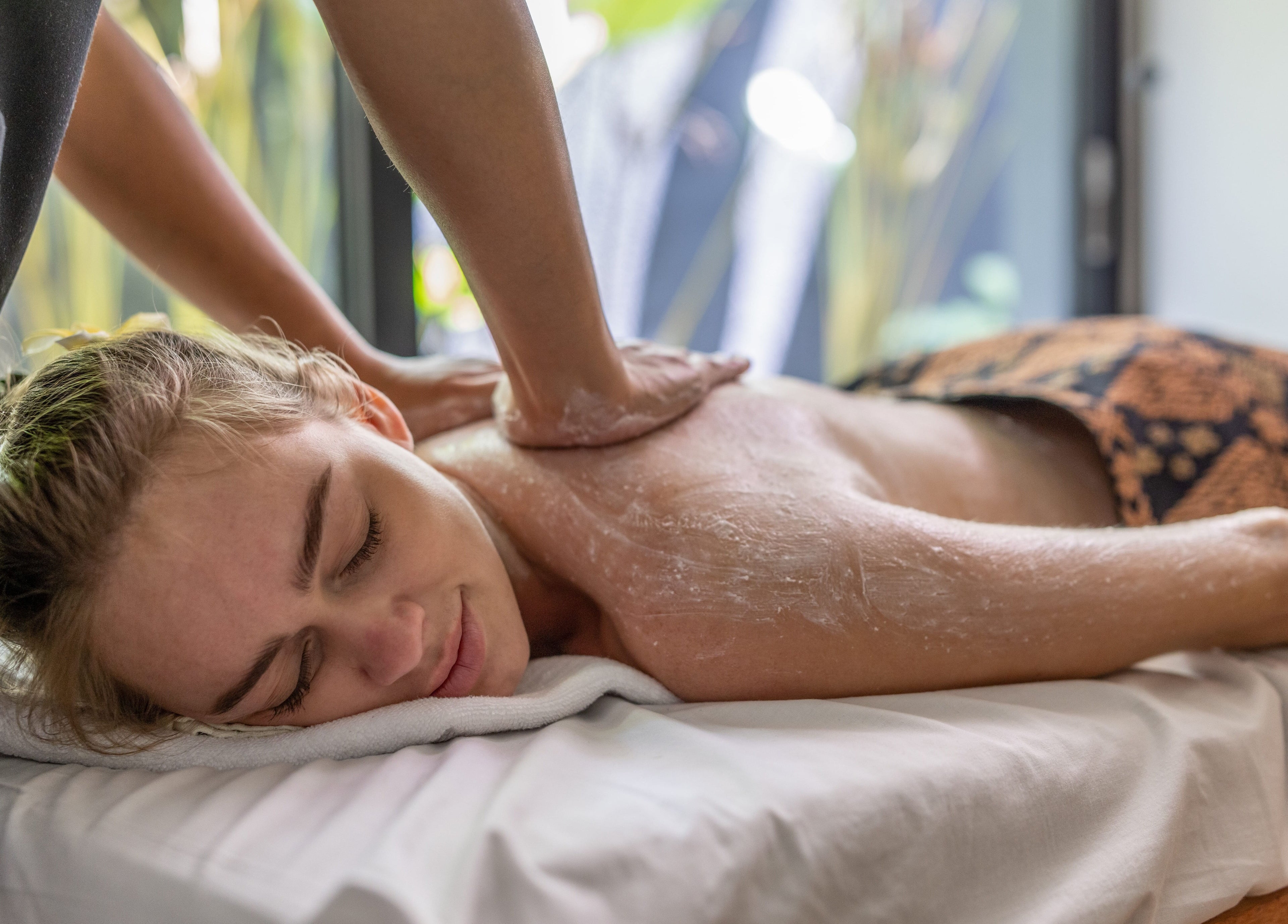 Relaxing back massage at Ame Spa Bali in Bali, ID, offering serene wellness experiences.