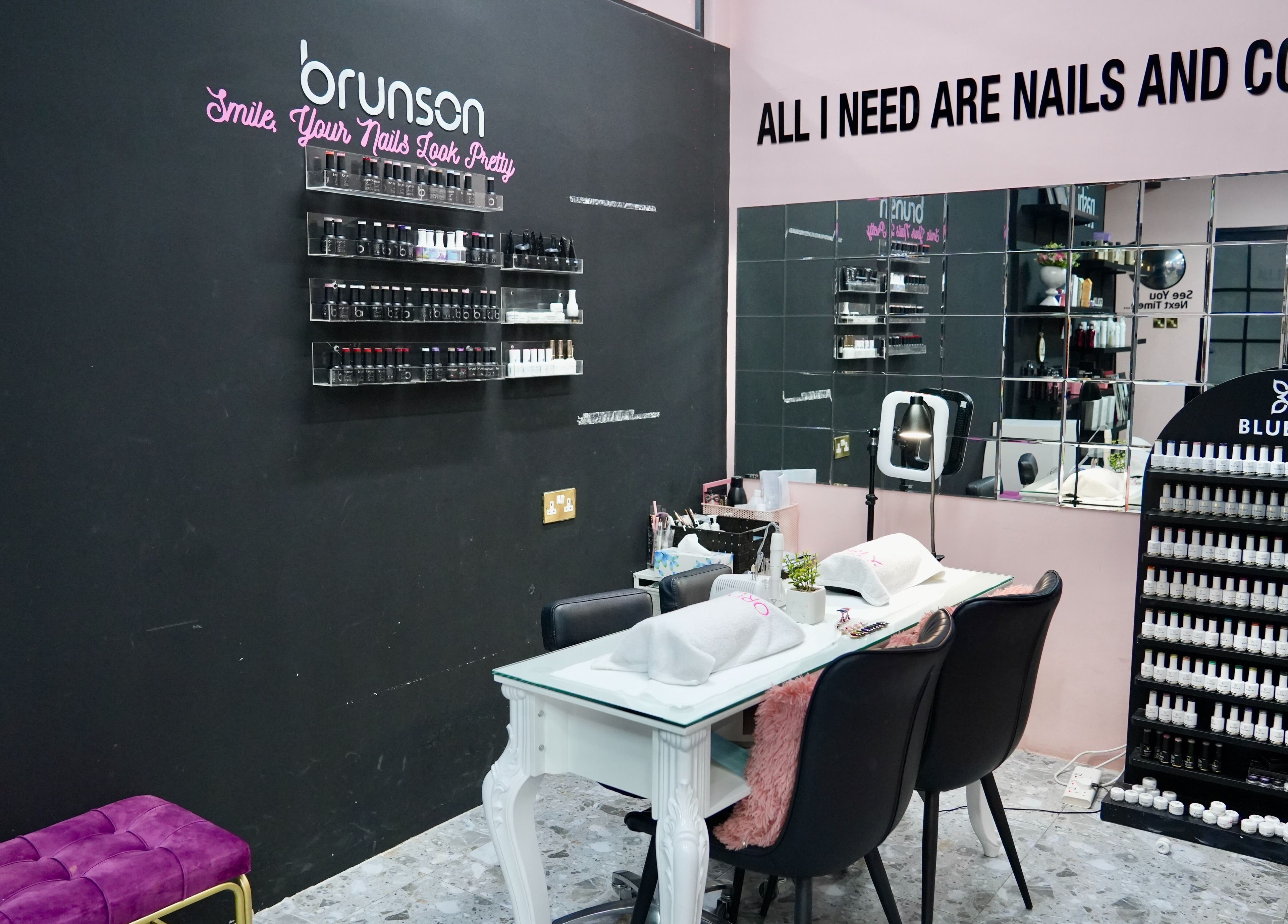 Nail station at Topone Salon & Spa in Muscat offers a stylish setting with nail polish displays.