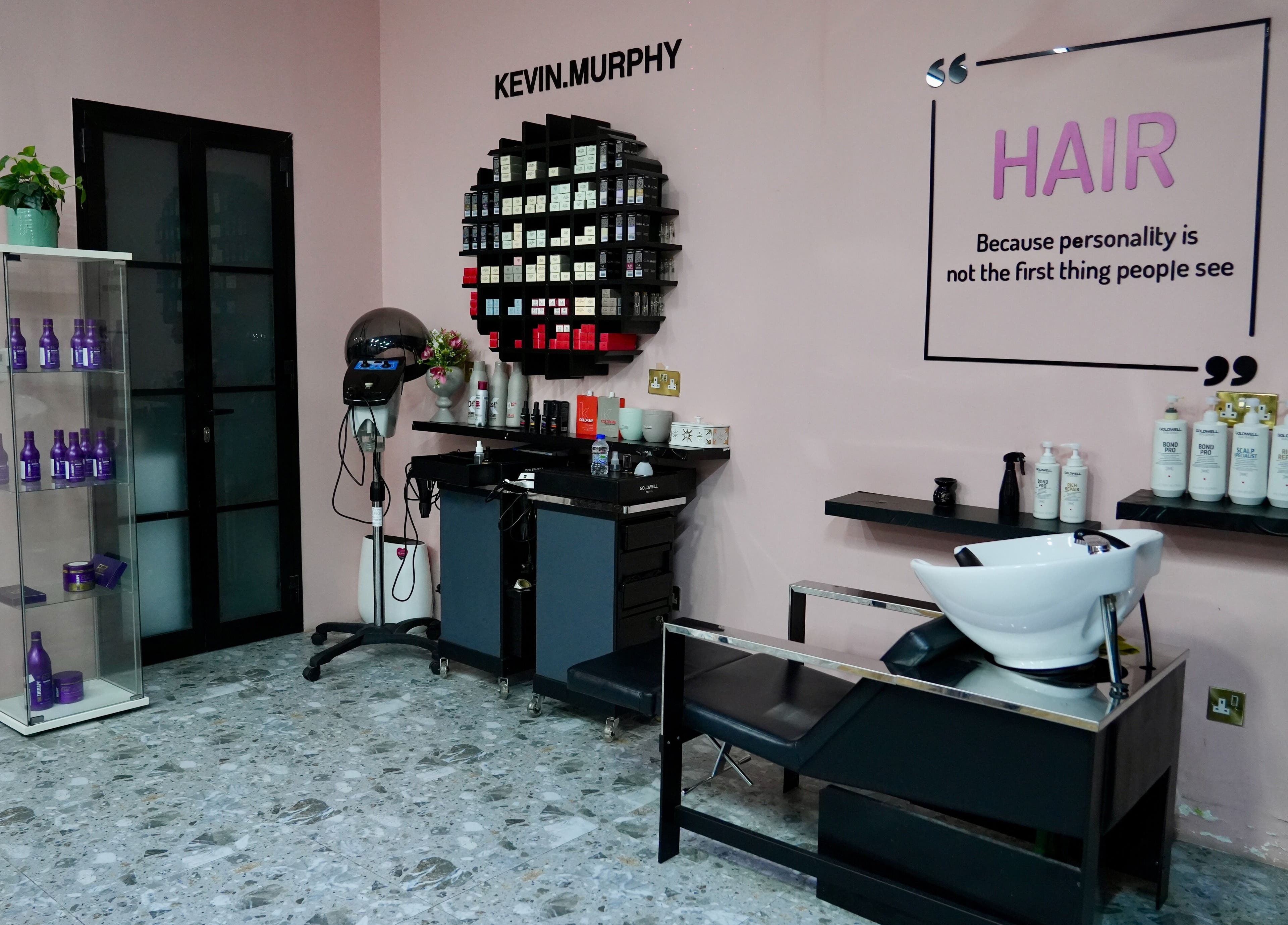 Interior of Topone Salon & Spa in Muscat, featuring hair care products and styling station.