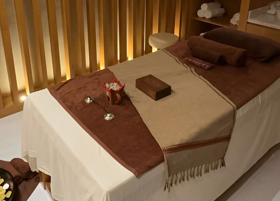 Massage table at Galo Spa, صلالة, محافظة ظفار, OM, with soft lighting and soothing ambiance.